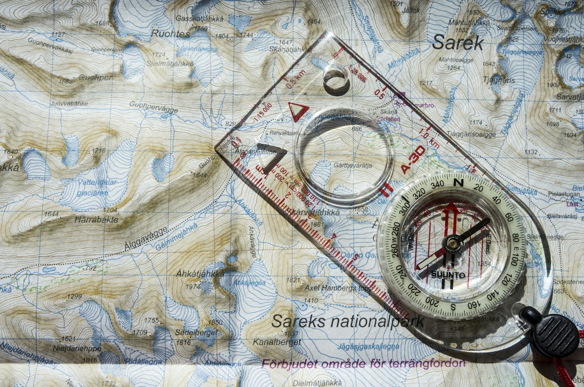 A compass on a paper map